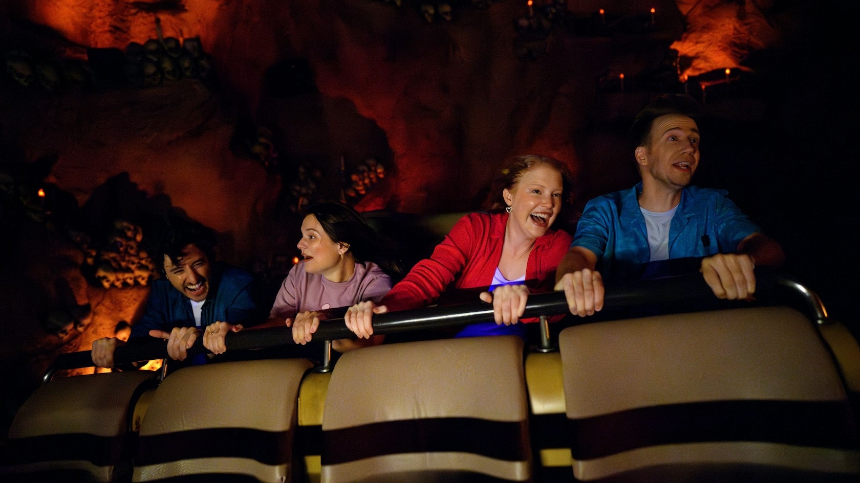 Guests riding in an Indiana Jones Adventure transport vehicle