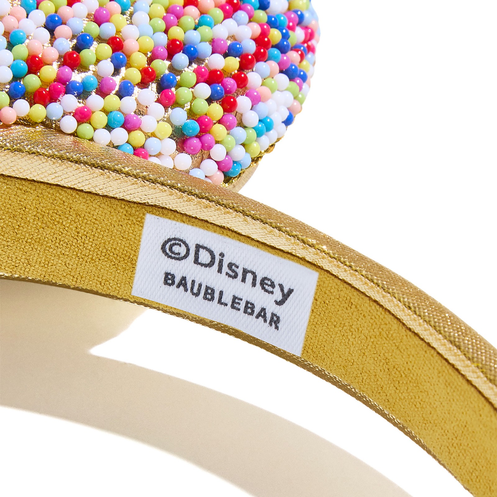 Back view of the gold confetti Minnie Mouse ear headband
