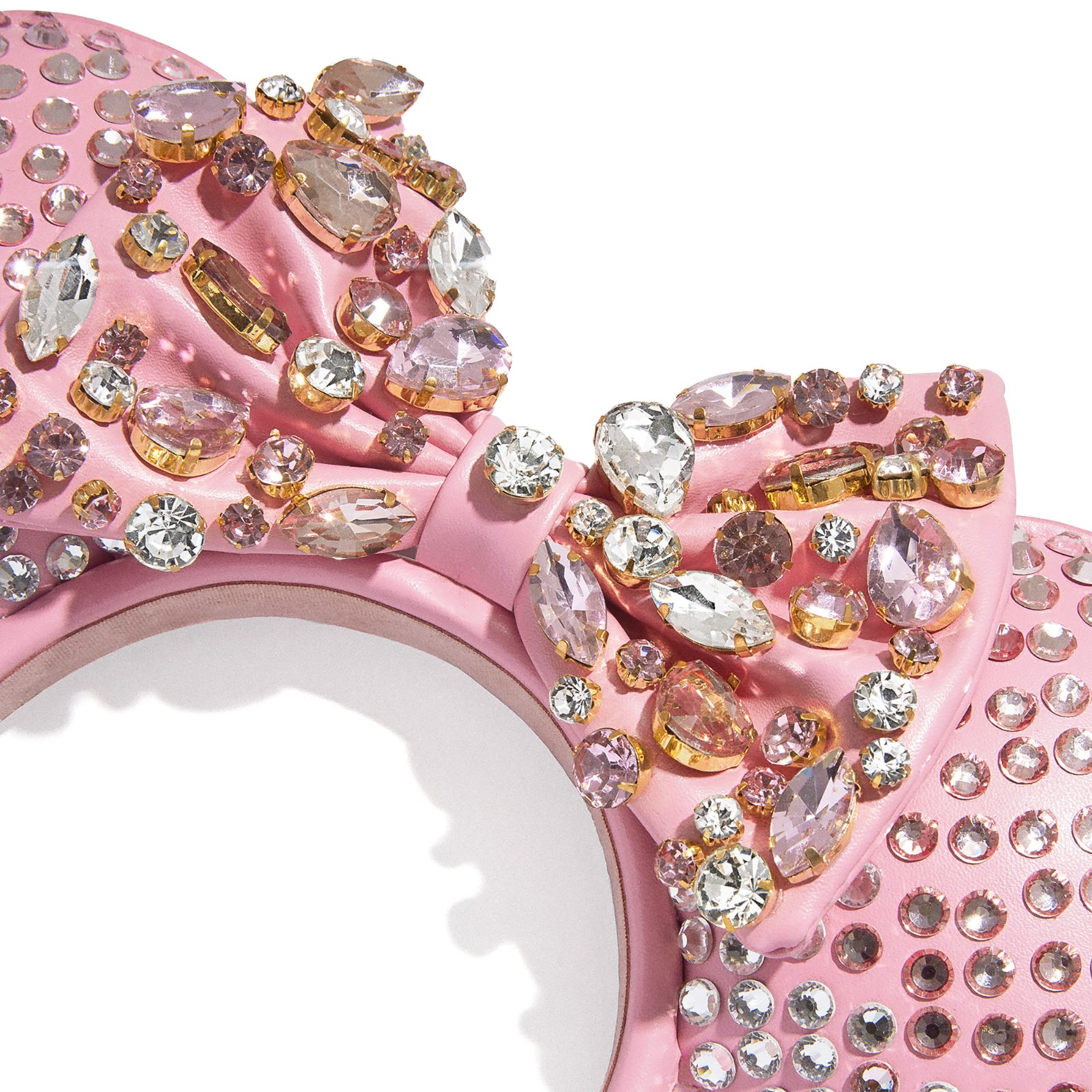 Side view of the pink crystal Minnie Mouse ear headband