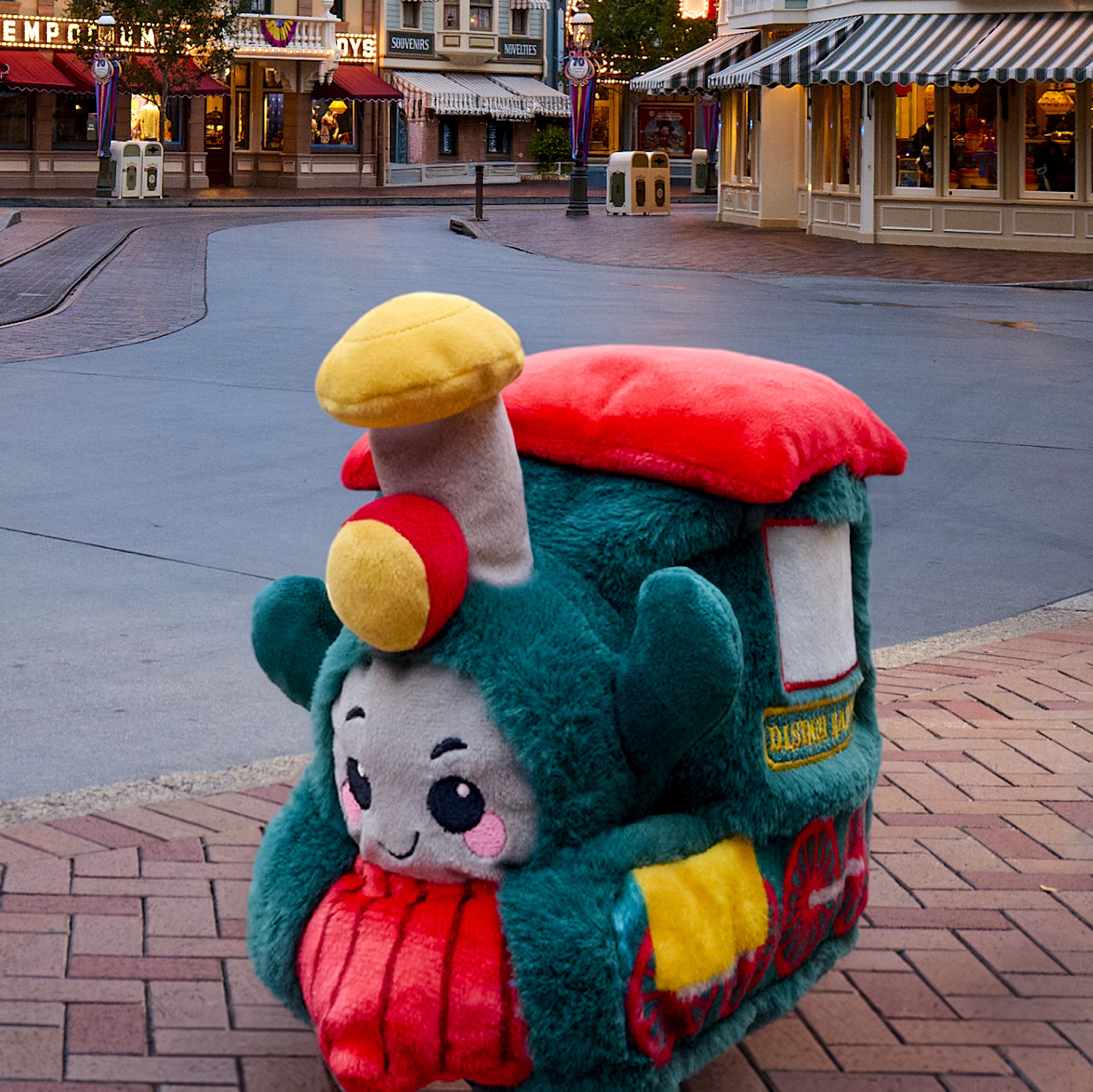 Green Disney Iconics train plush with red engine details