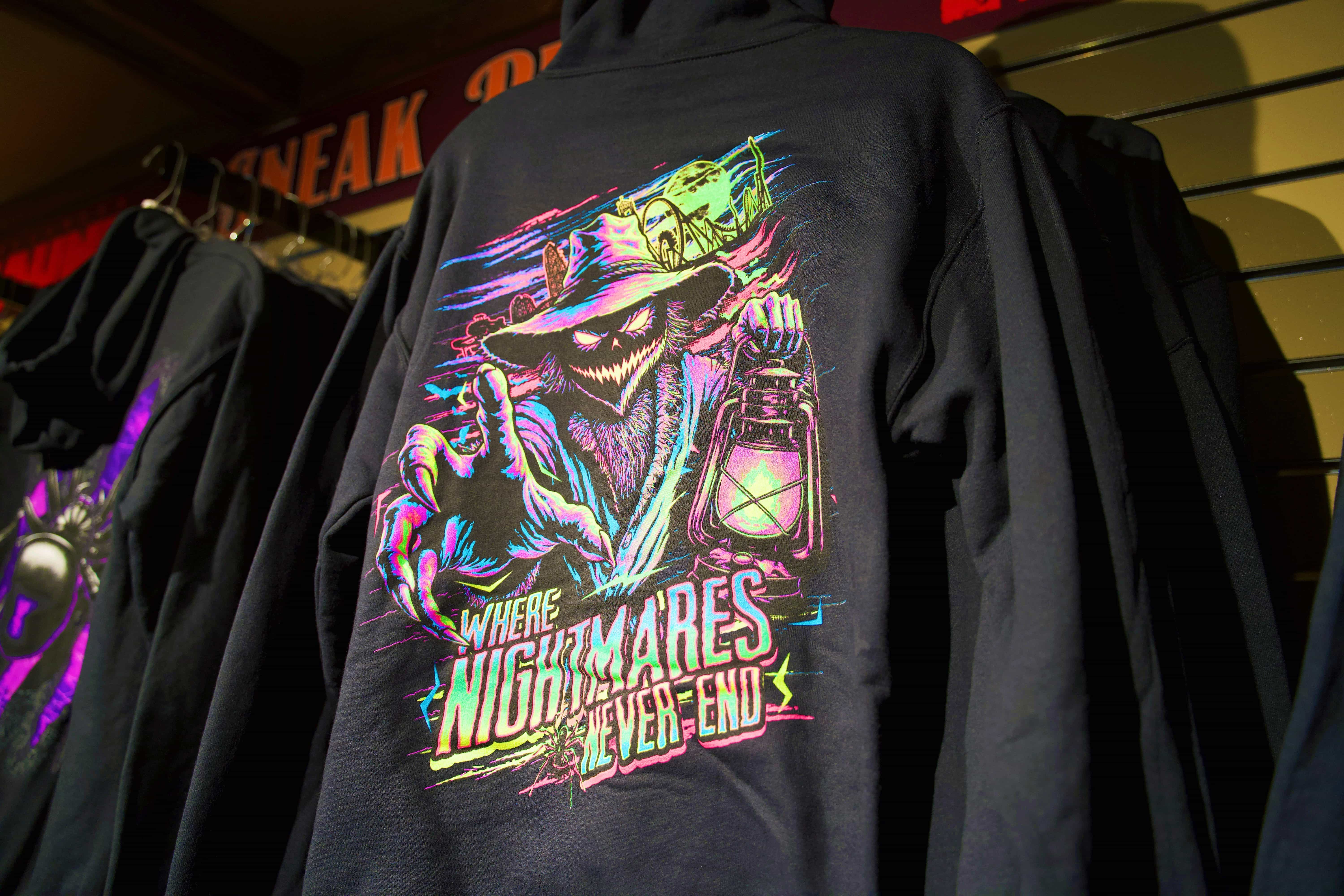 Black Dorney Park HAUNT hoodie with colorful witch, creature and lantern artwork