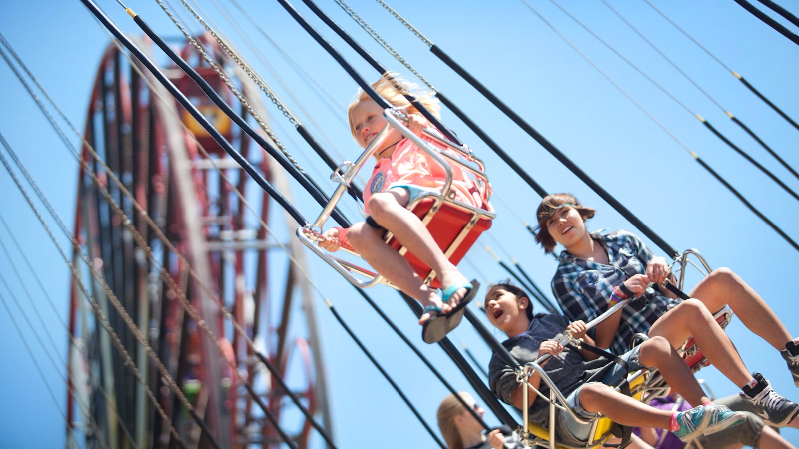 Guests ride Silly Symphony Swings at Disney California Adventure