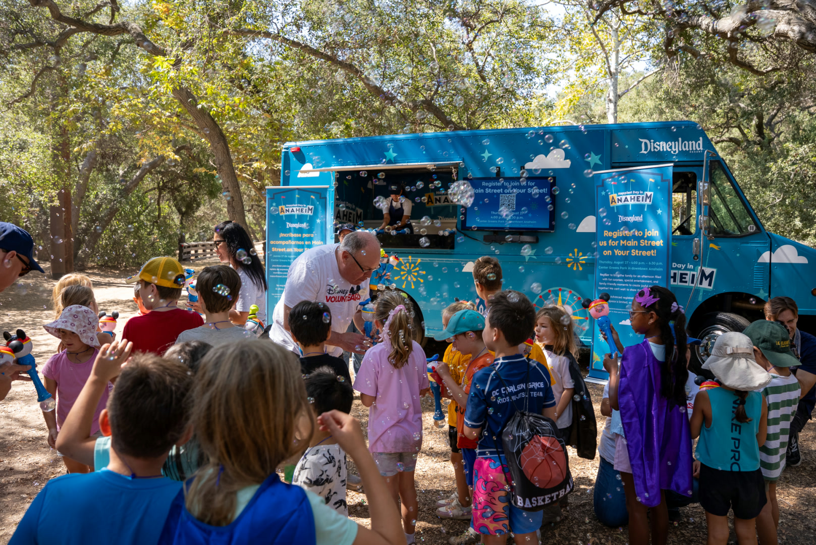 Disney VoluntEARS distribute treats from a Disneyland Resort truck at an Anaheim community event