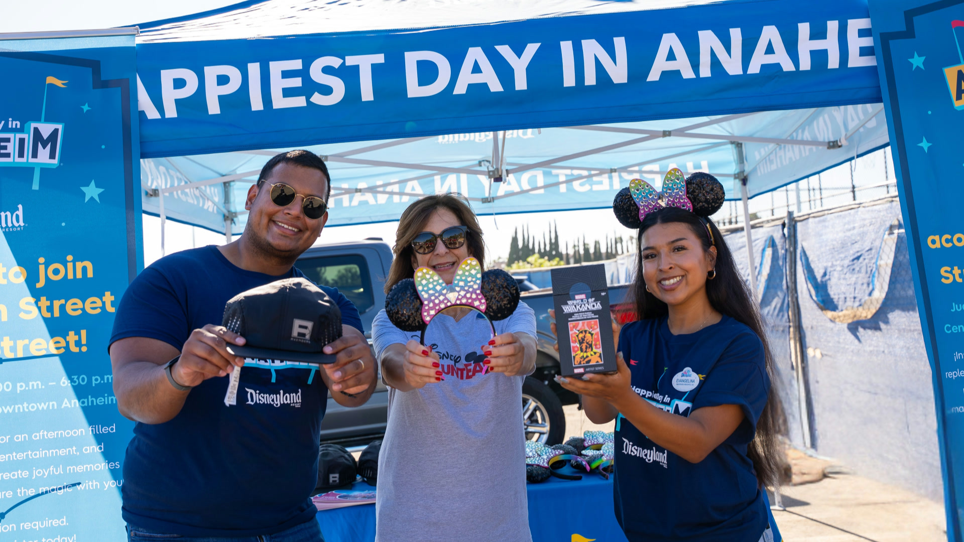 Disney VoluntEARS and an Anaheim resident at a Happiest Day in Anaheim community stop