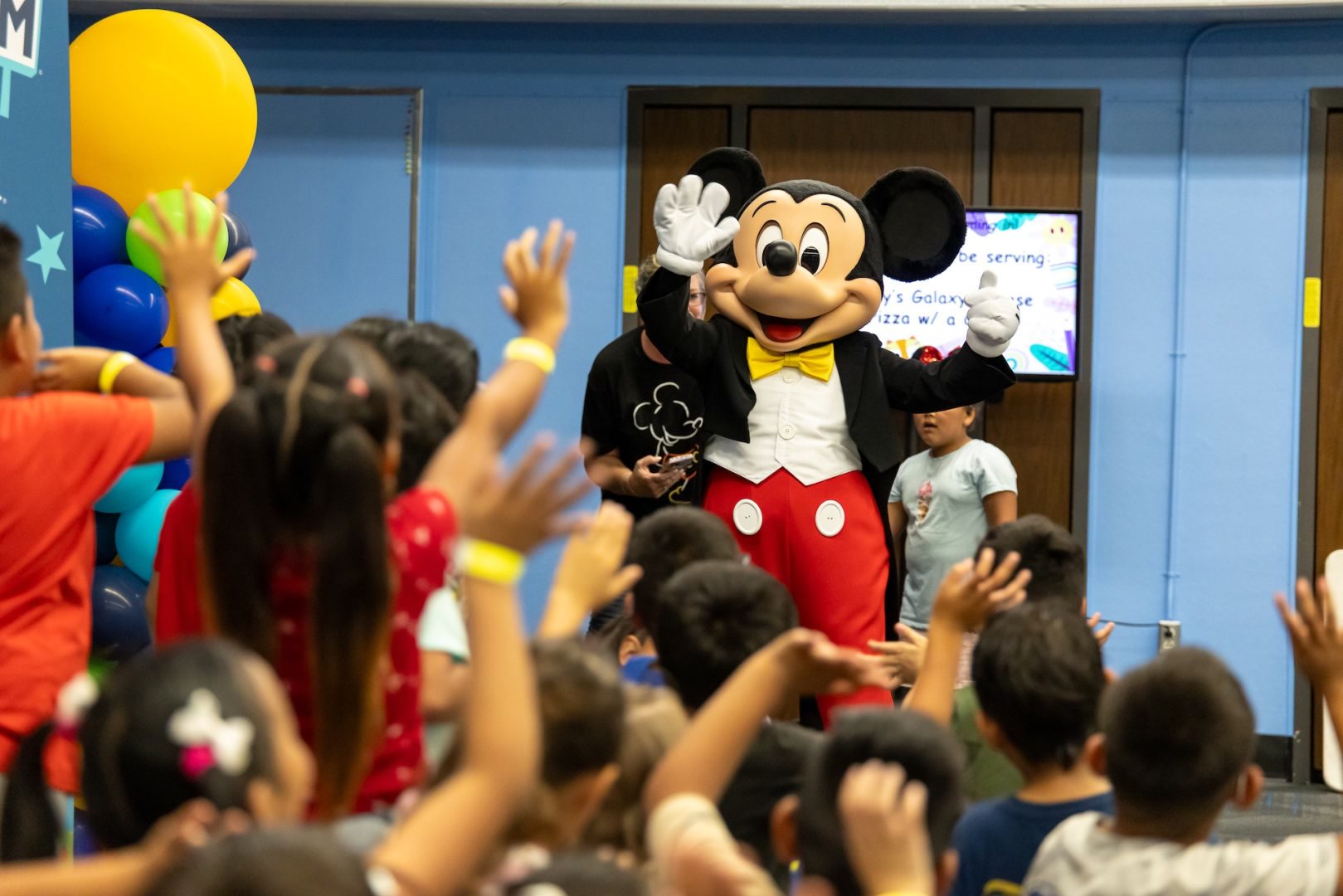 Mickey Mouse greets students during The Happiest Day in Anaheim field day