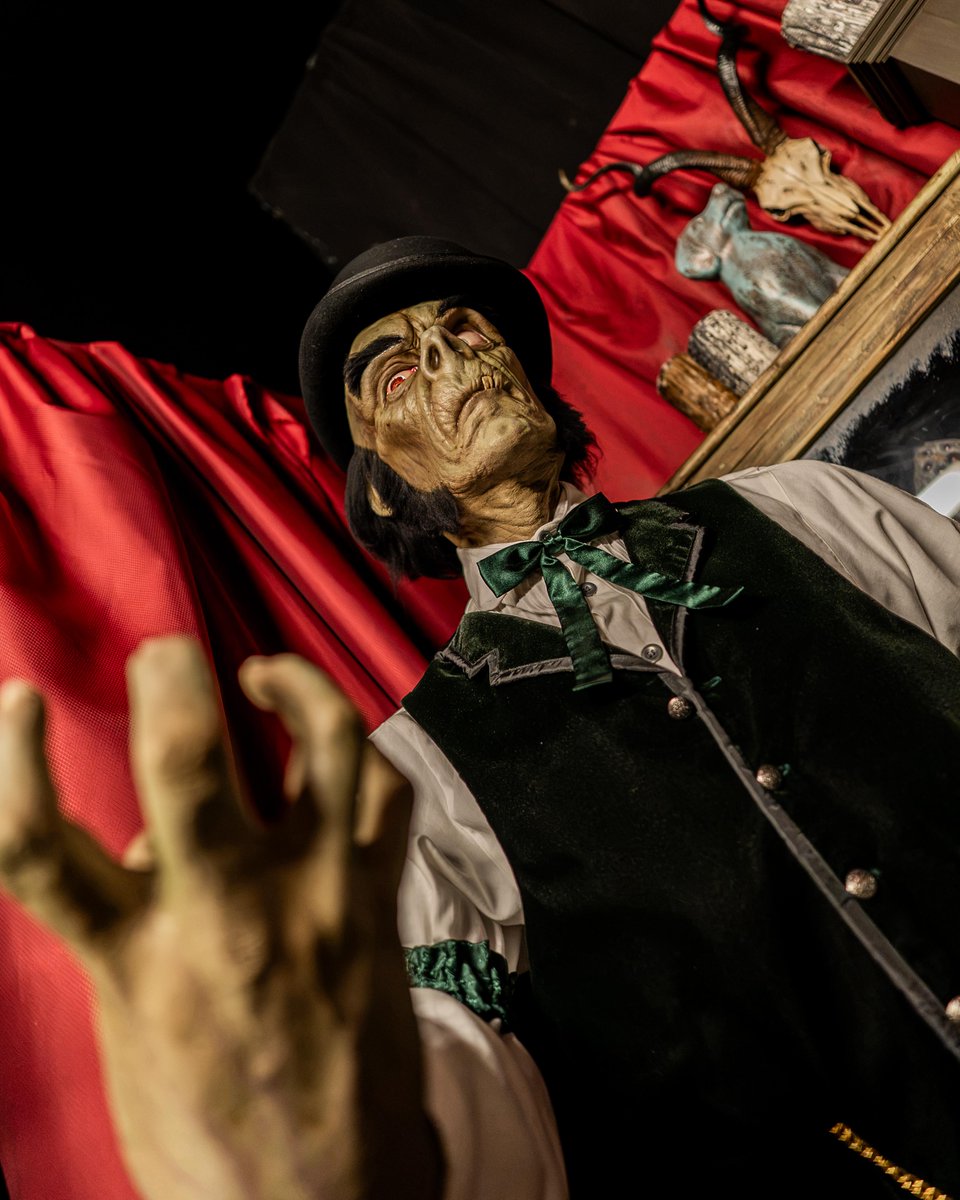 Curator figure inside the Halloween Horror Nights 35 Tribute Store