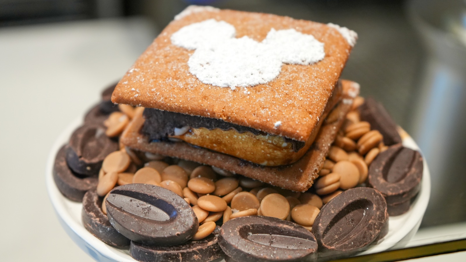 Pumpkin Spice S’more with a Mickey-shaped powdered sugar design at The Ganachery