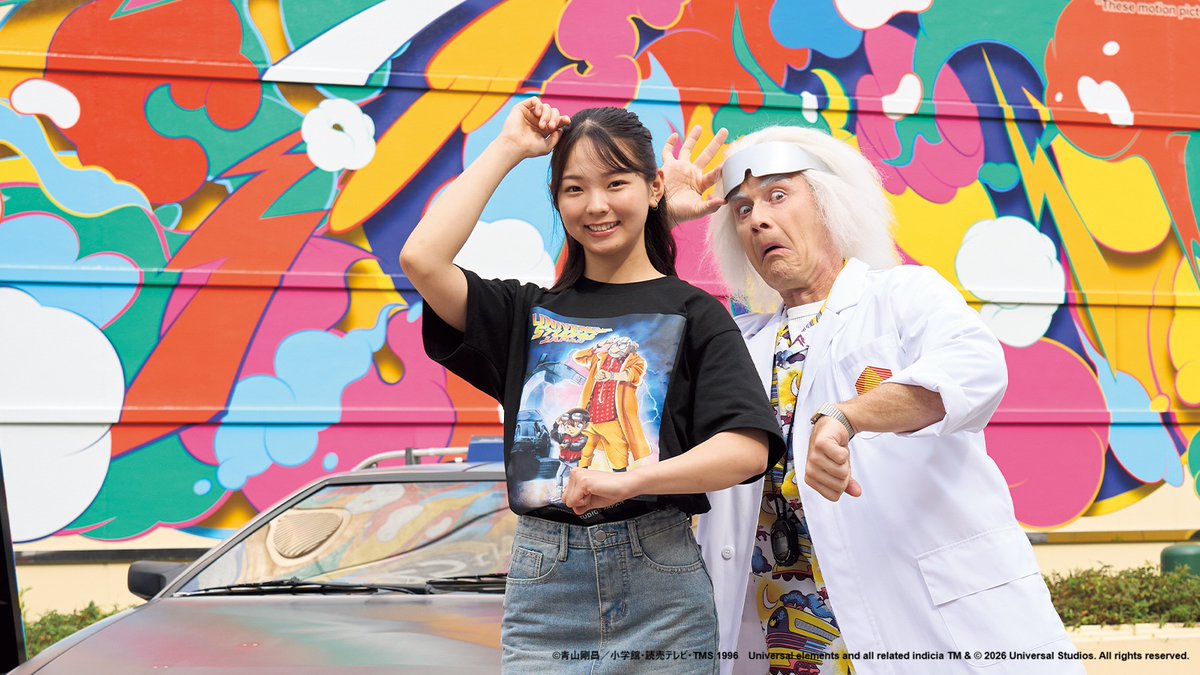 Model wearing the Detective Conan and Back to the Future T-shirt beside Doc Brown at Universal Studios Japan
