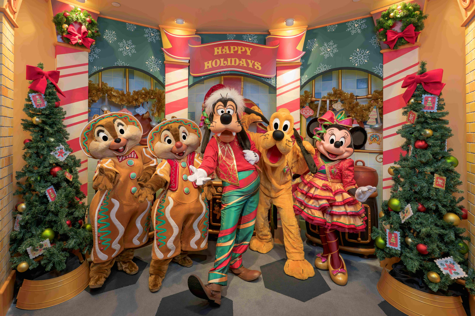 Goofy and Disney friends in holiday outfits at Goofy's Kitchen
