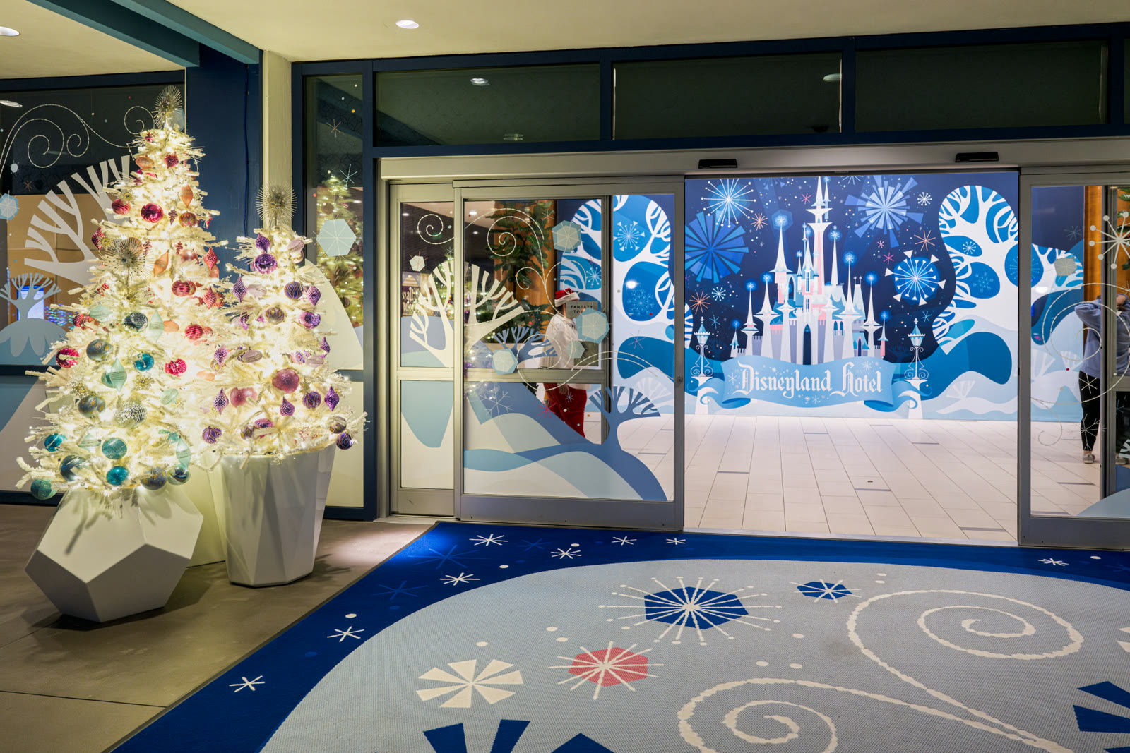 Holiday decorations at the Disneyland Hotel in an official Disneyland Resort image