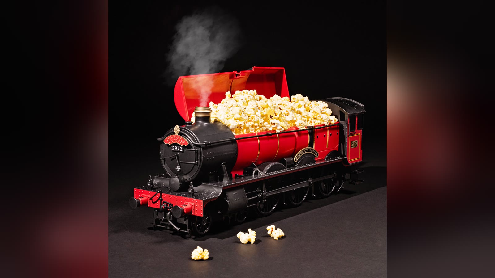 Steam-producing Hogwarts Express popcorn bucket filled with popcorn