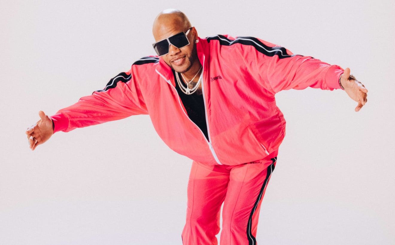 Flo Rida wearing a bright pink tracksuit in an official Busch Gardens Williamsburg concert image