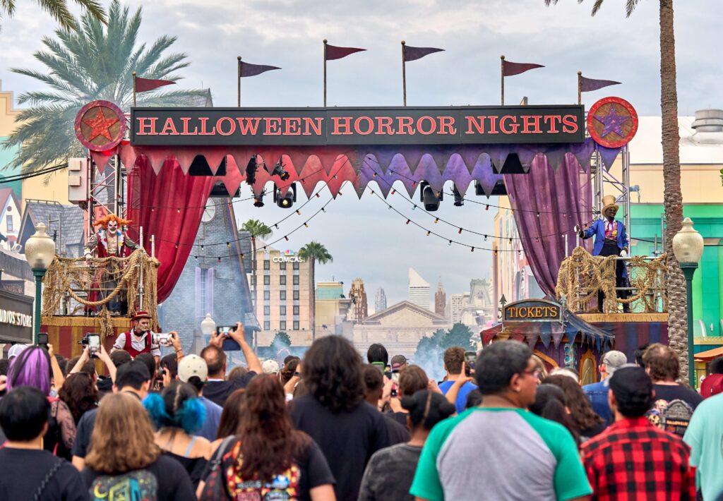 Halloween Horror Nights entrance at Universal Studios Florida with performers and guests