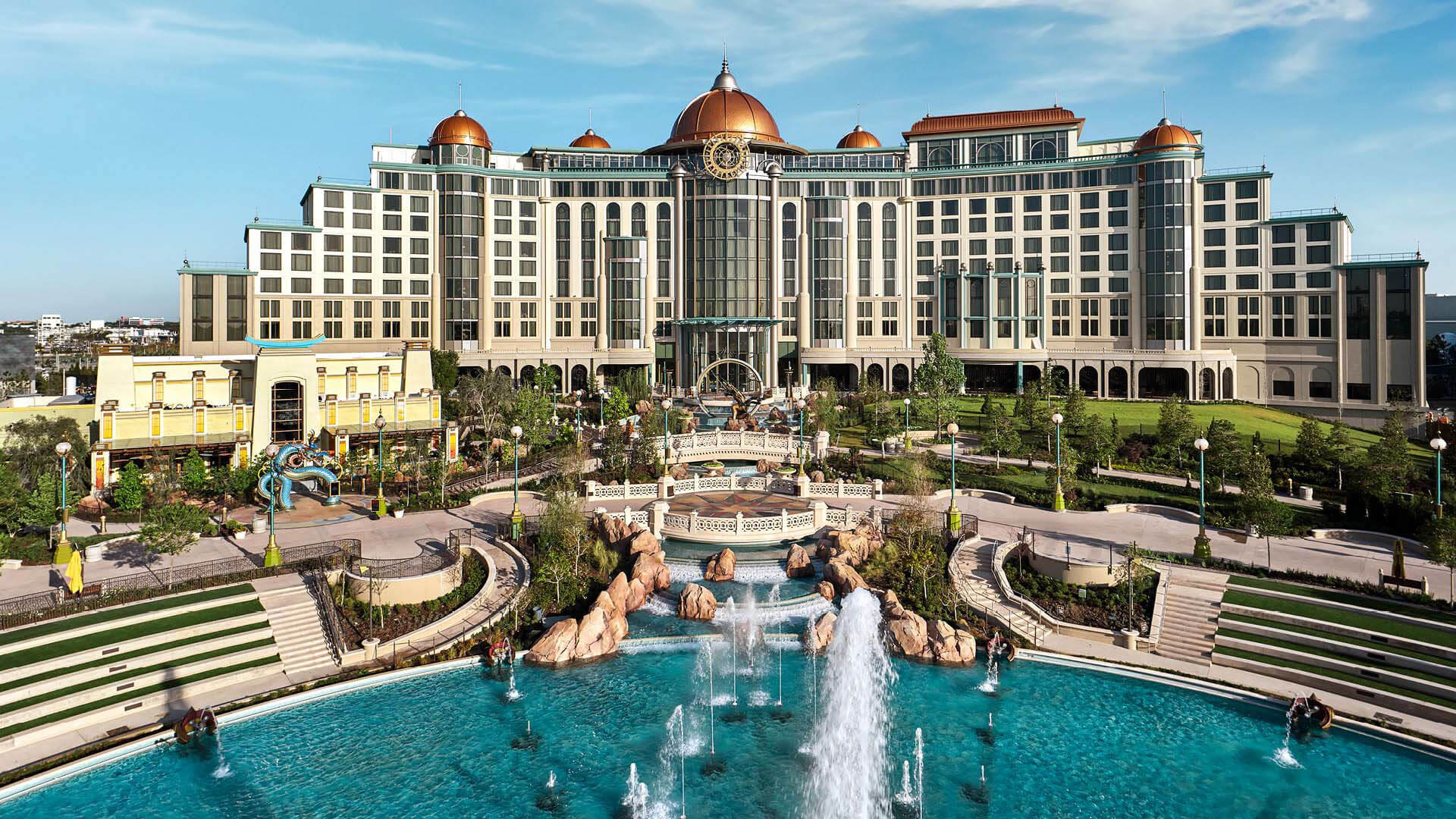 Universal Helios Grand Hotel above the gardens and fountains of Celestial Park