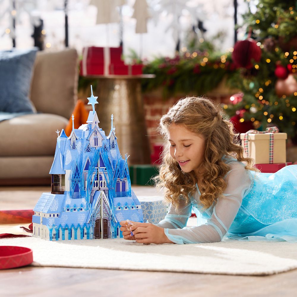 Frozen 2 castle play set shown open beside a child