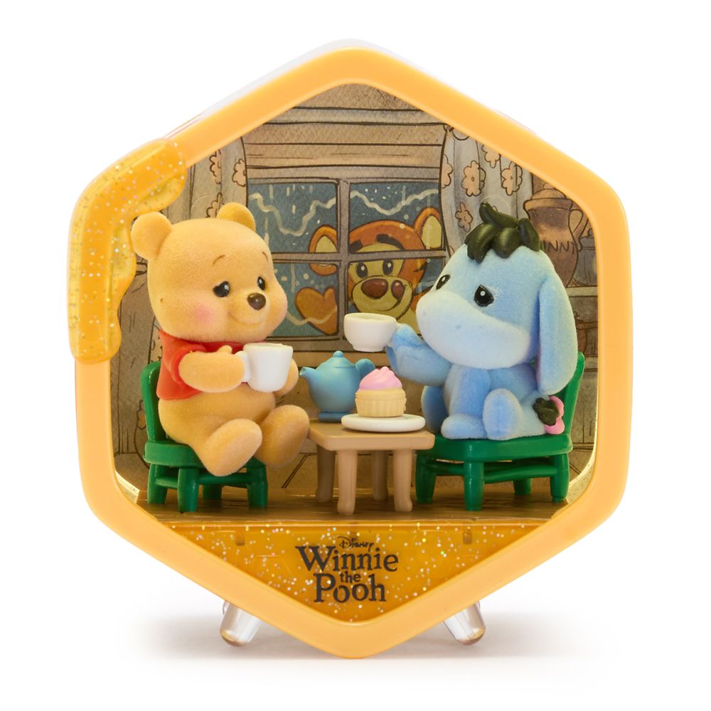 Winnie the Pooh and Eeyore having tea in a Honeycomb Homes scene