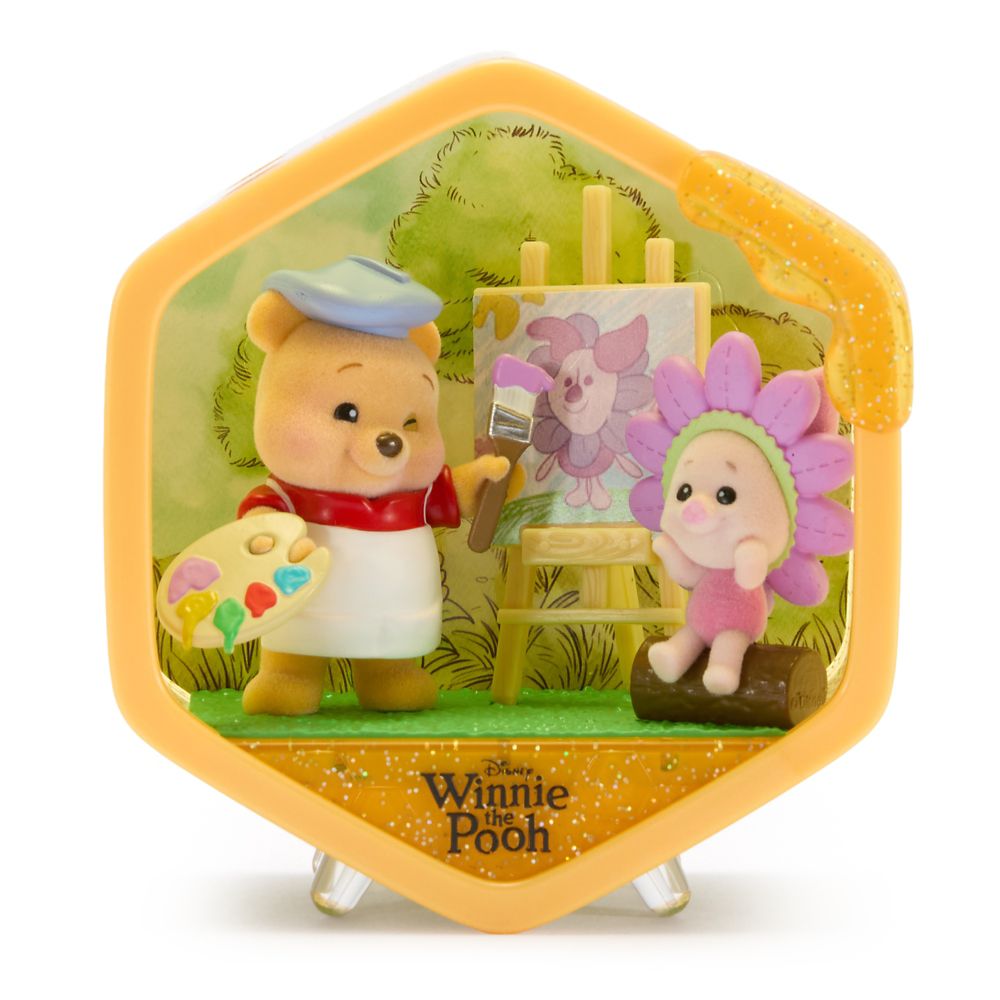 Winnie the Pooh painting with a friend in a Honeycomb Homes scene