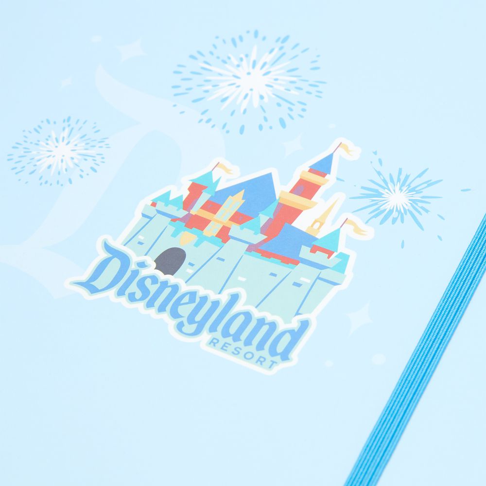 Open Disneyland Junk Journal showing blank pages and stickers