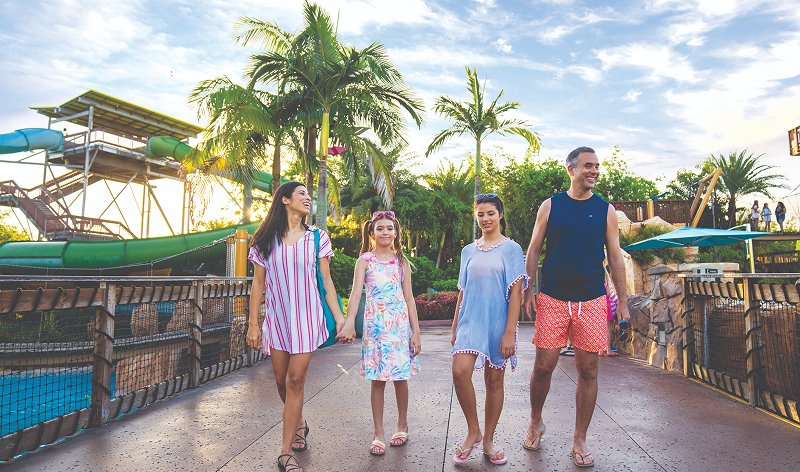 Guests walking across Aquatica Orlando's bridge