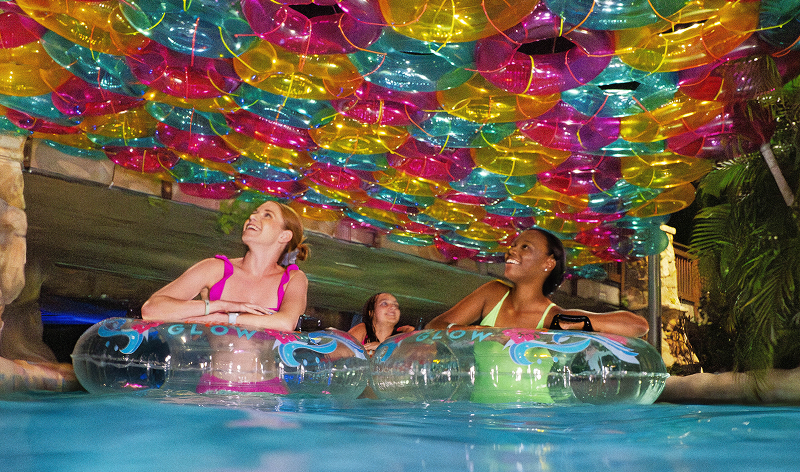 Guests dining beneath Aquatica Orlando waterslides