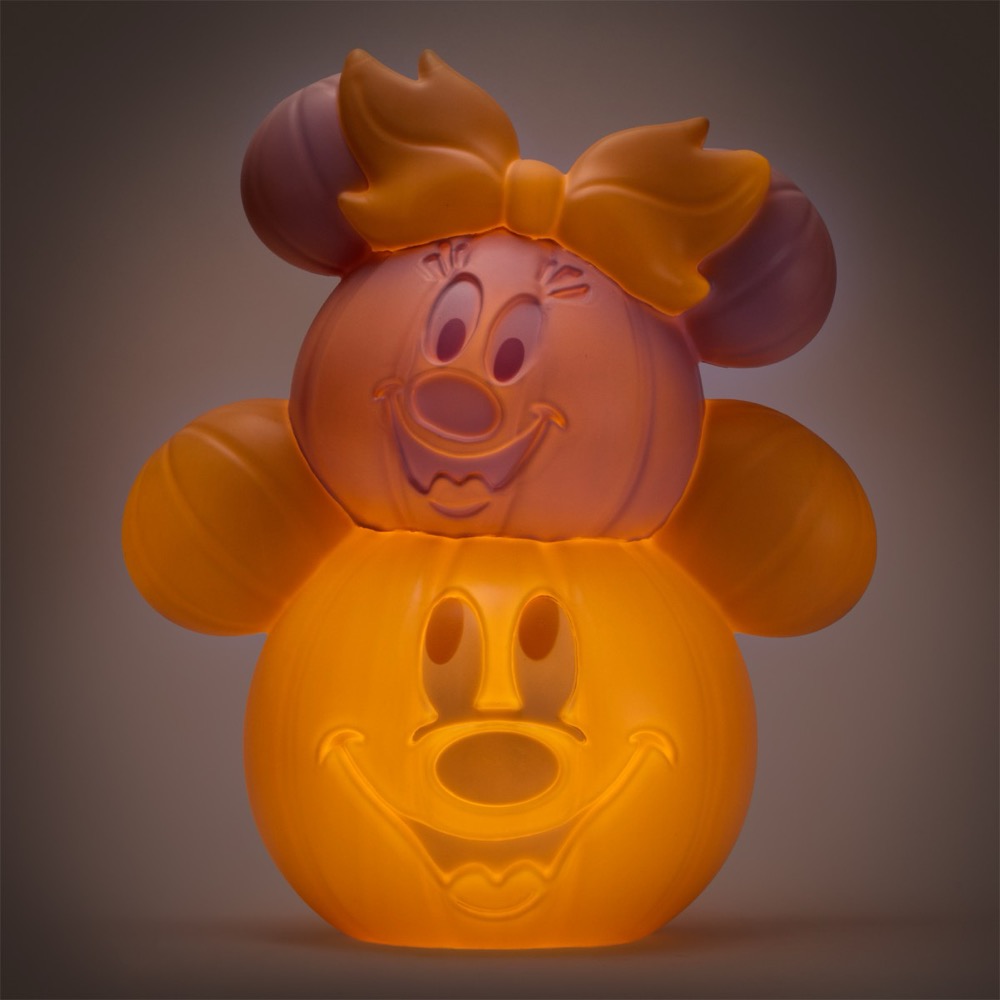 Minnie and Mickey pastel jack-o'-lantern decor lit in orange