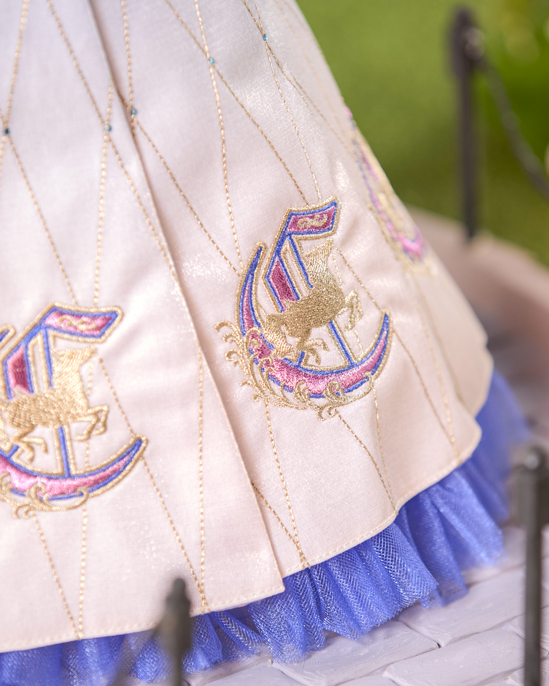 Close view of the Cinderella doll's embroidered dress
