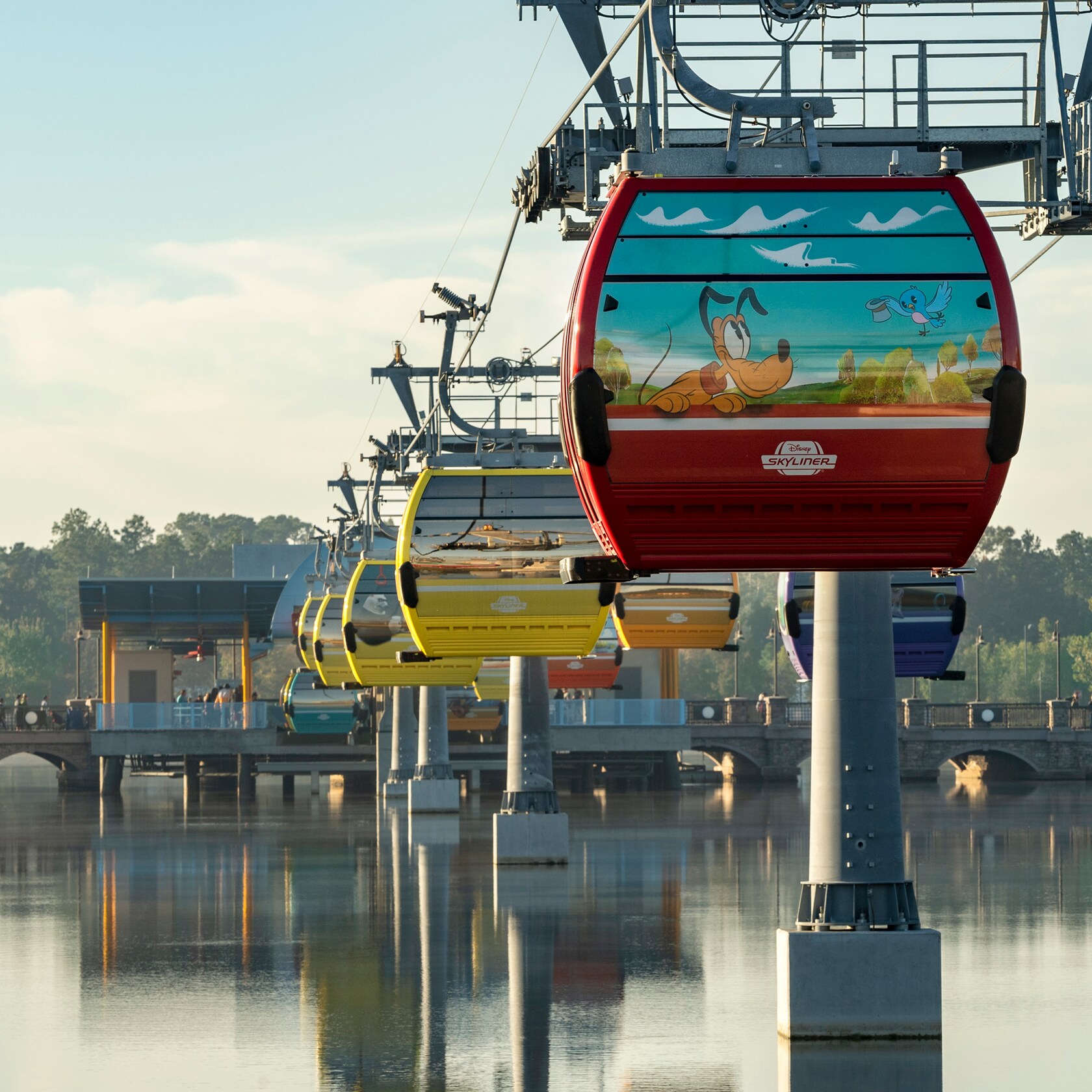 Guests riding the Disney Skyliner over Walt Disney World