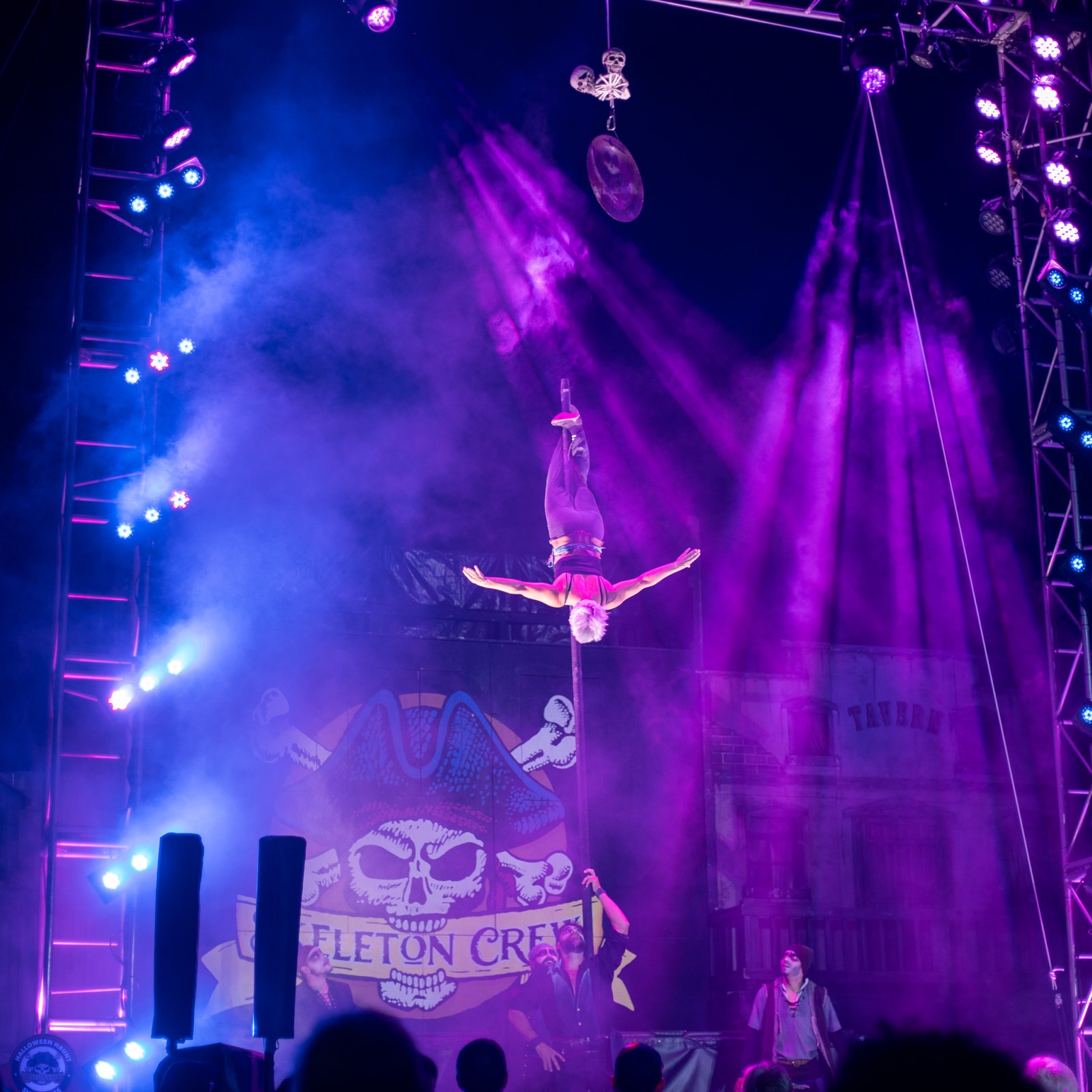 An acrobat performs above a Halloween Haunt stage at Dorney Park