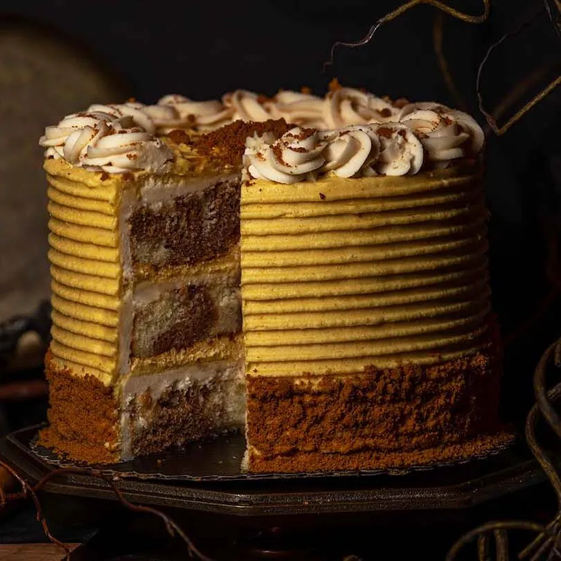 Gideon’s Pumpkin Caramel Double Frosted Cake slice with pumpkin and caramel frosting
