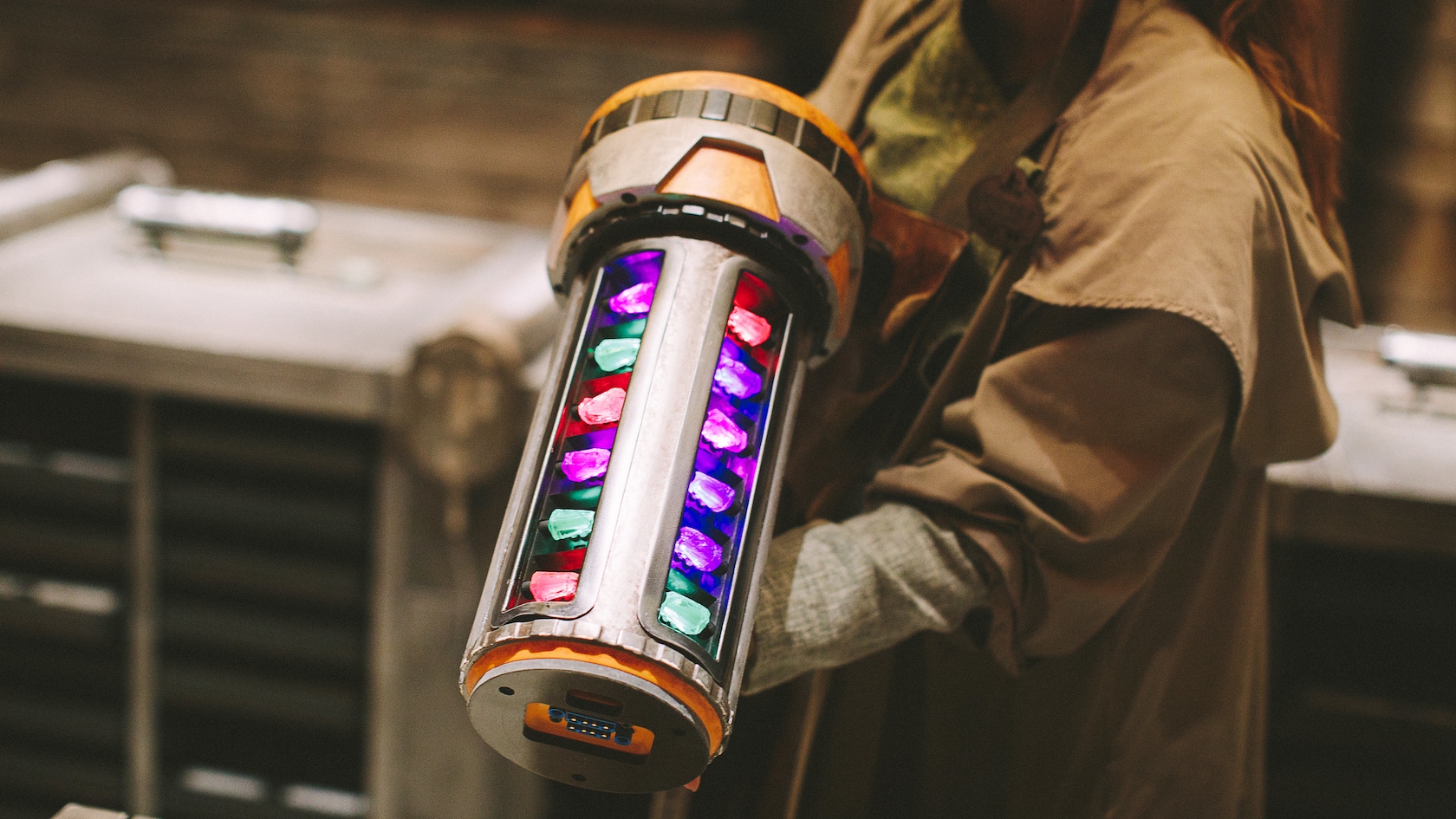 Colorful kyber crystals inside a lightsaber hilt at Savi’s Workshop