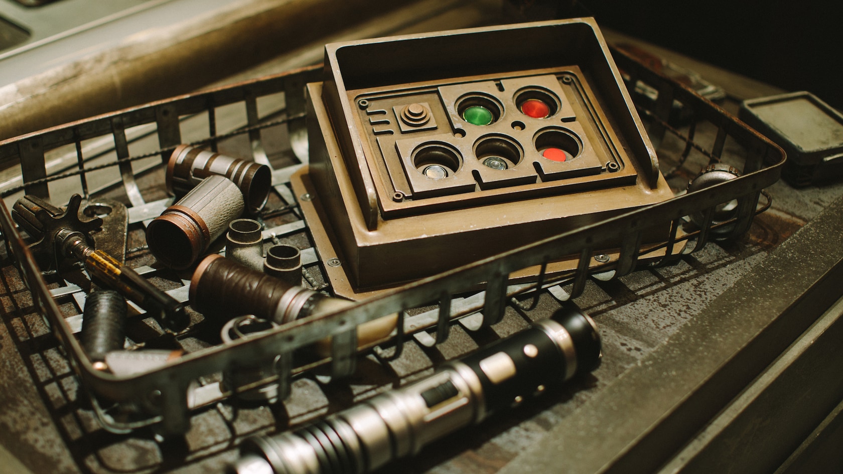 Lightsaber parts arranged in a Savi’s Workshop display drawer