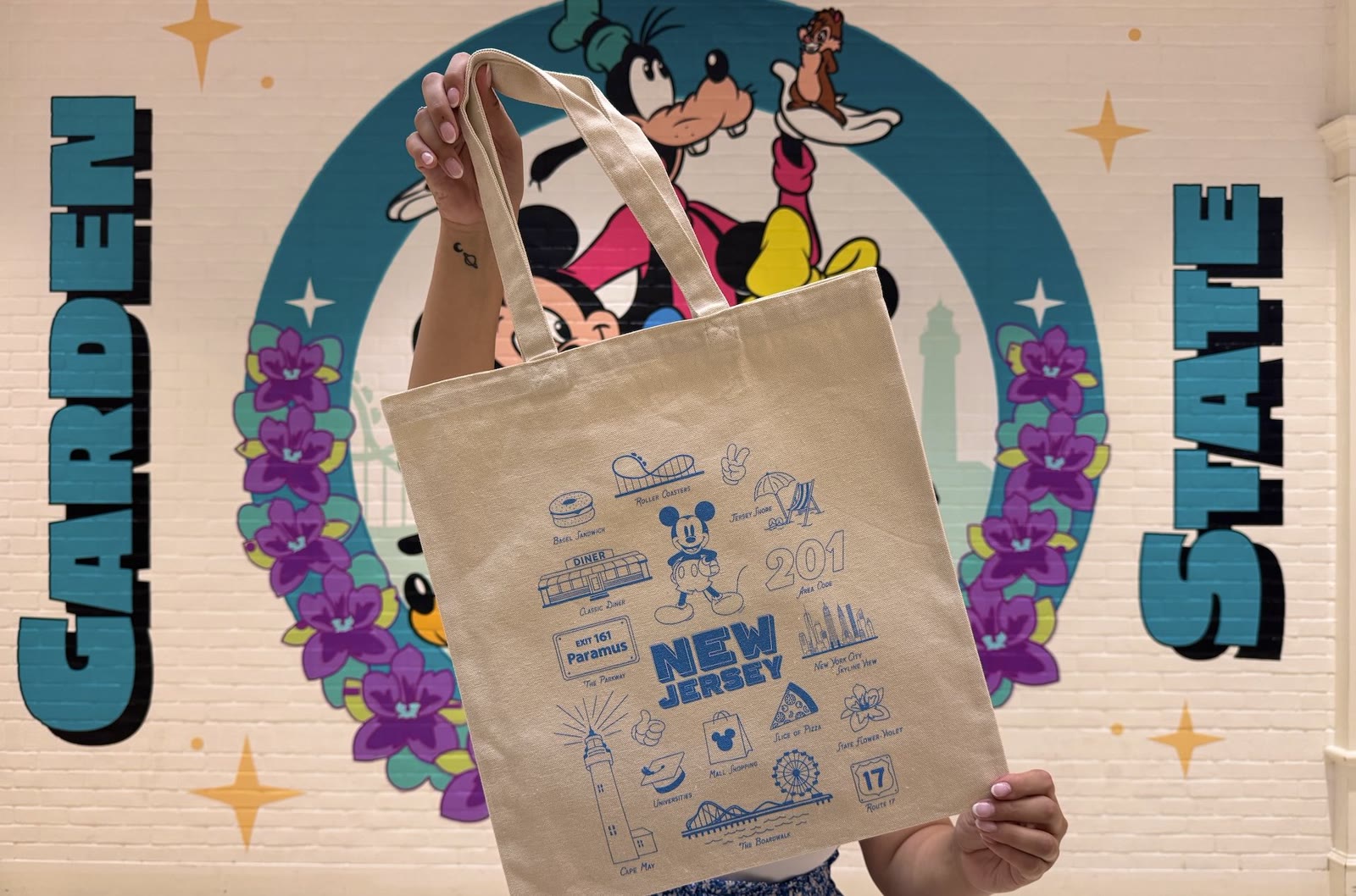 New Jersey exclusive tote in front of Disney Store Limited Time artwork