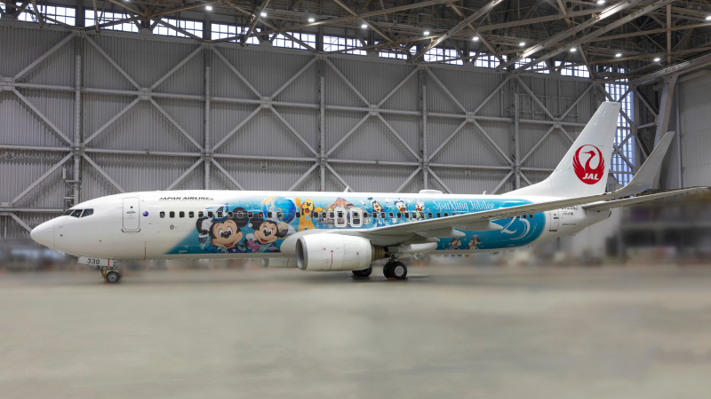 JAL Jubilee Express Boeing 737-800 inside a hangar