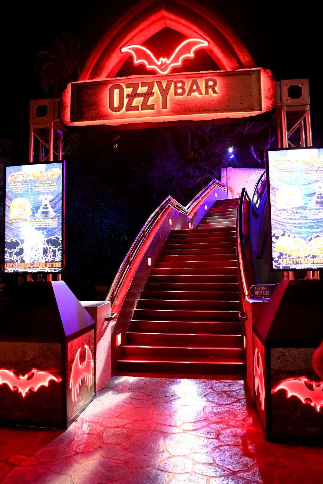 A red guitar display beneath the Ozzybar sign