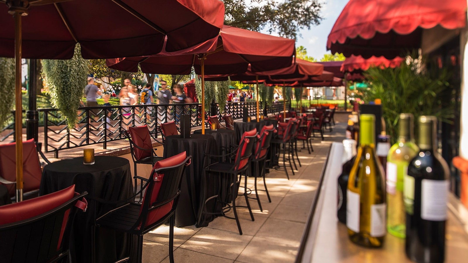 Official photograph of the Brown Derby Lounge patio before refurbishment, with red umbrellas over the tables