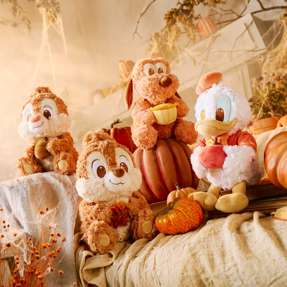 Fall Vibes character plush in an autumn display