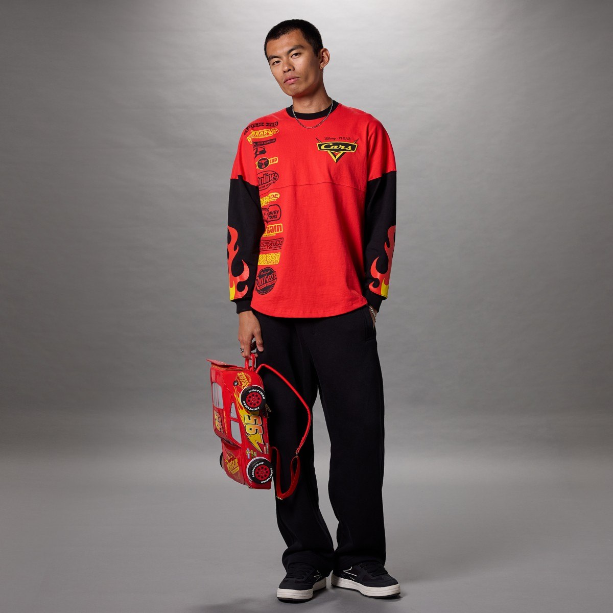 Model carrying the Lightning McQueen backpack