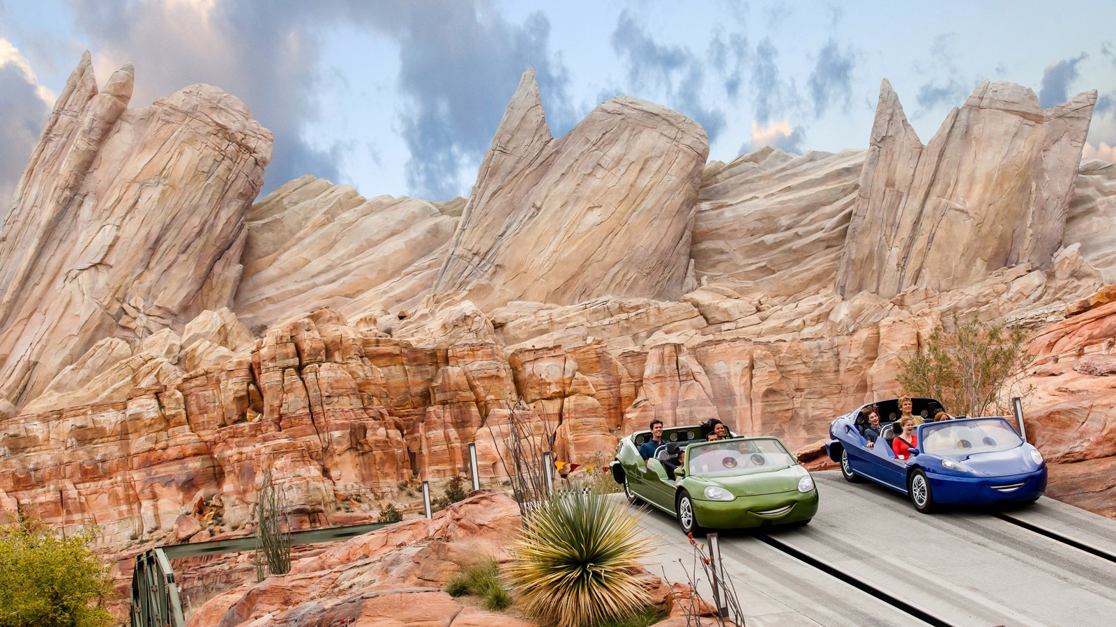 Official Disneyland Resort photograph of two Radiator Springs Racers cars beside the Cadillac Range