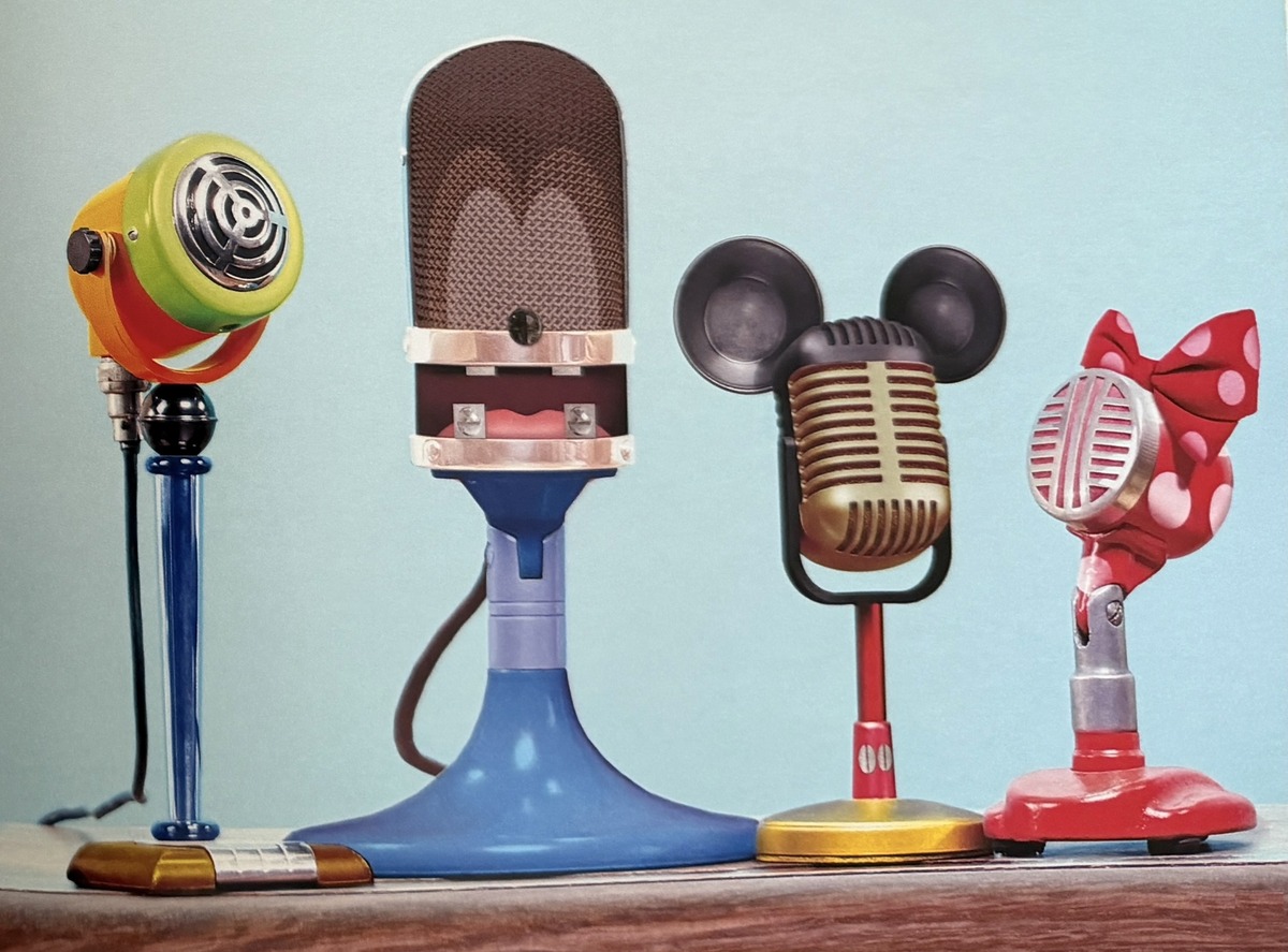 Mickey and Minnie microphones beside colorful vintage microphones