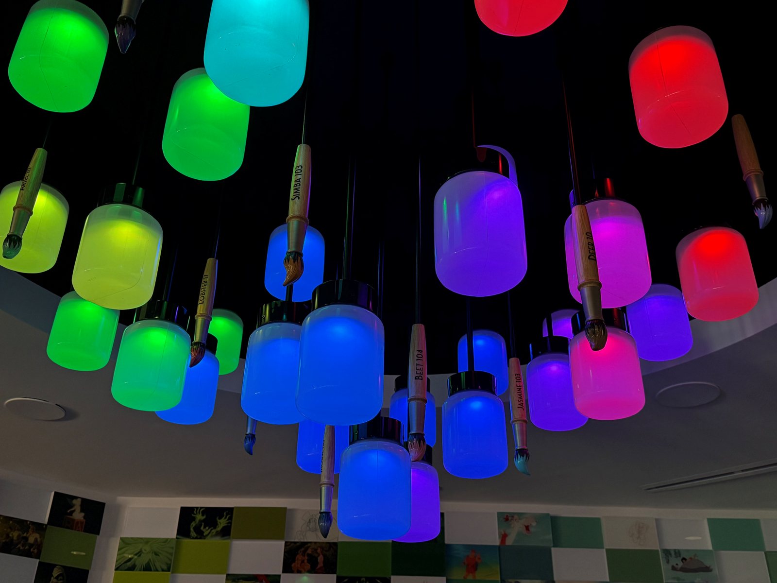 Colorful paintbrushes hang above the reception area
