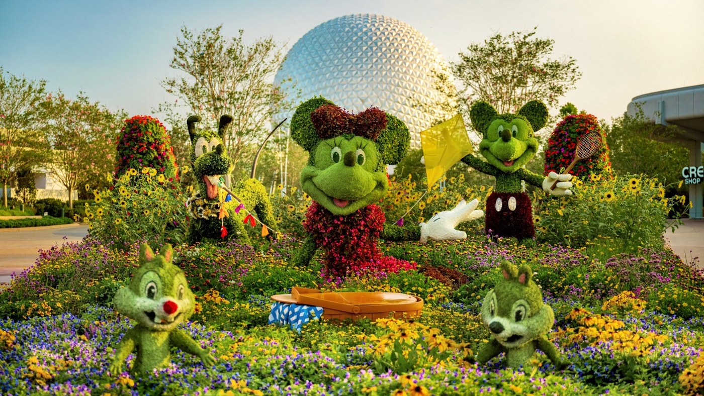 Mickey Mouse and friends appear as topiaries in front of Spaceship Earth at EPCOT