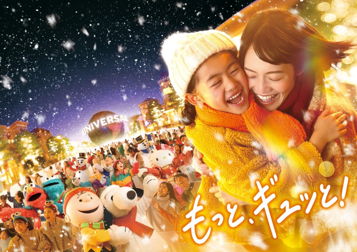 A family surrounded by Universal Studios Japan characters and holiday performers under falling snow