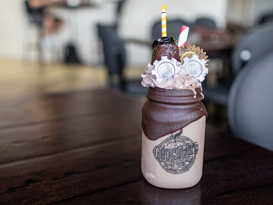 The Cheers to 10 Years shake with chocolate gears and a chocolate candle.