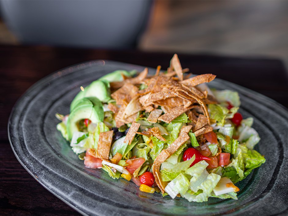 Sedona BBQ Chicken Salad with chipotle grilled chicken, corn, black beans and avocado.