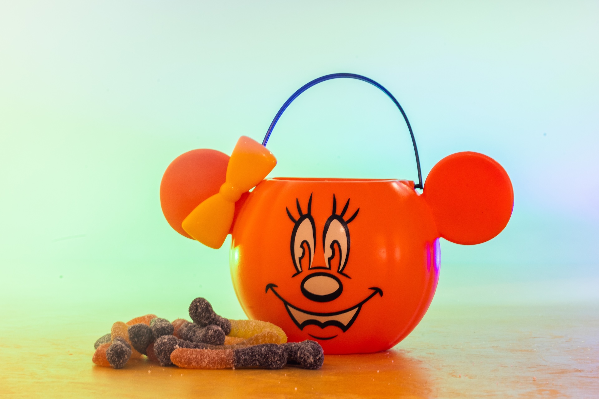 Pumpkin Minnie Halloween candy bucket with sour worms in Disney’s official product photo