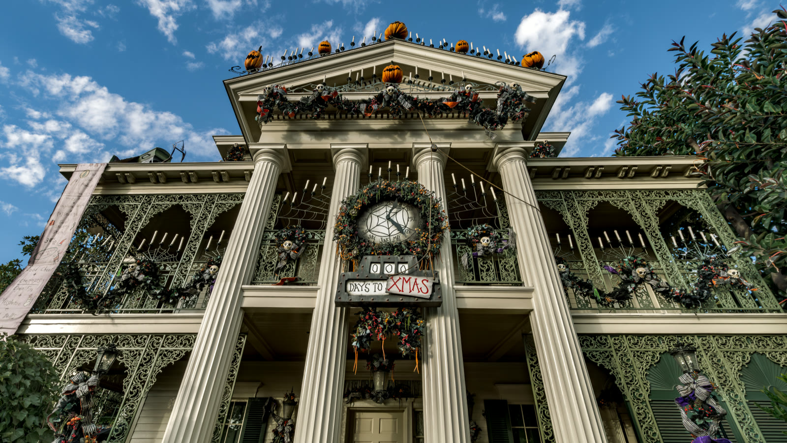Haunted Mansion Holiday exterior at Disneyland decorated for the season