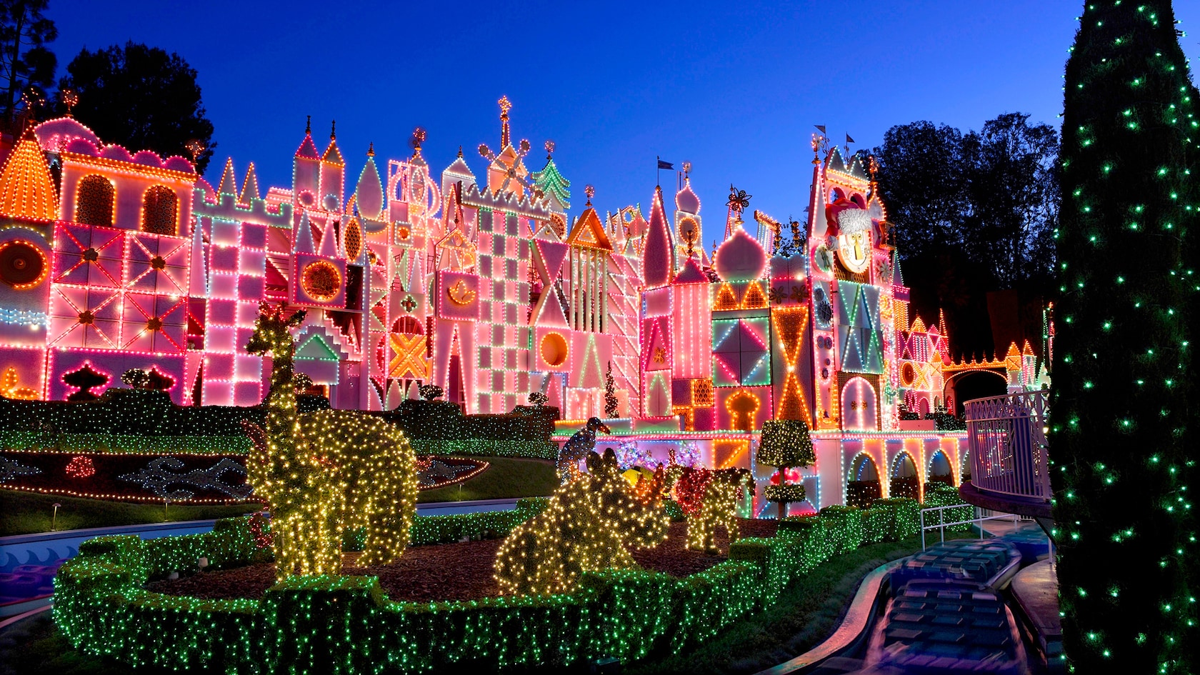 Disneyland's it’s a small world Holiday facade lit up after dark