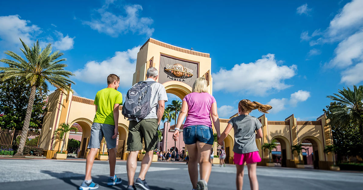 Guests walk toward the entrance arches at Universal Studios Florida