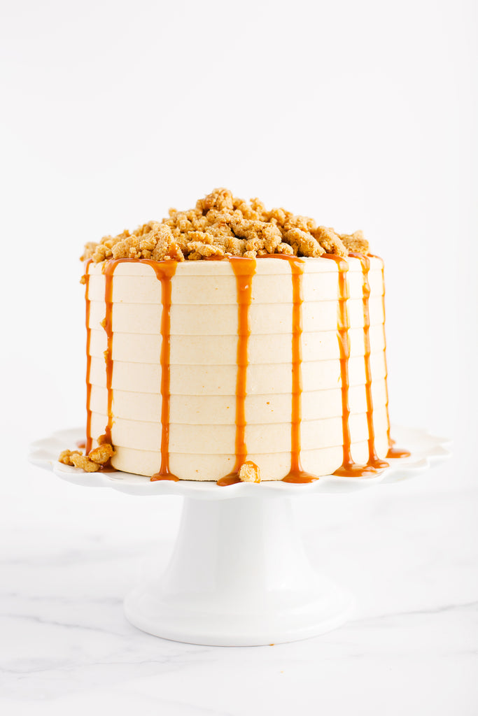 Apple Crumble Cake topped with crumbles and caramel