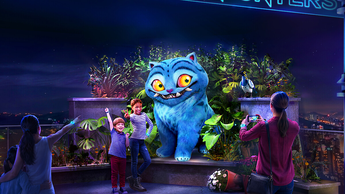 Concept art shows guests meeting Derpy Tiger and Sussie Bird at the KPop Demon Hunters experience